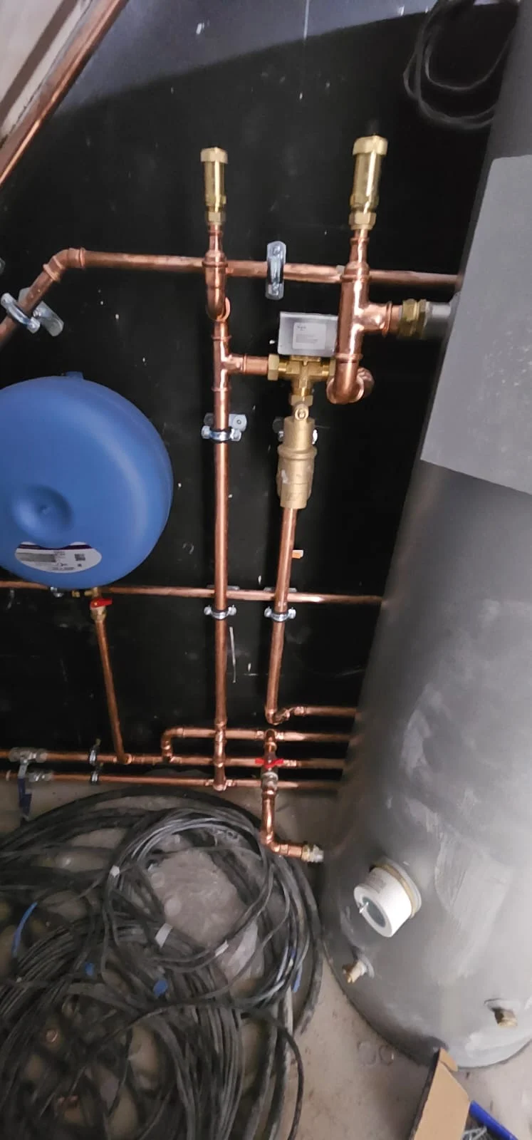Expansion vessel beside the hot water cylinder