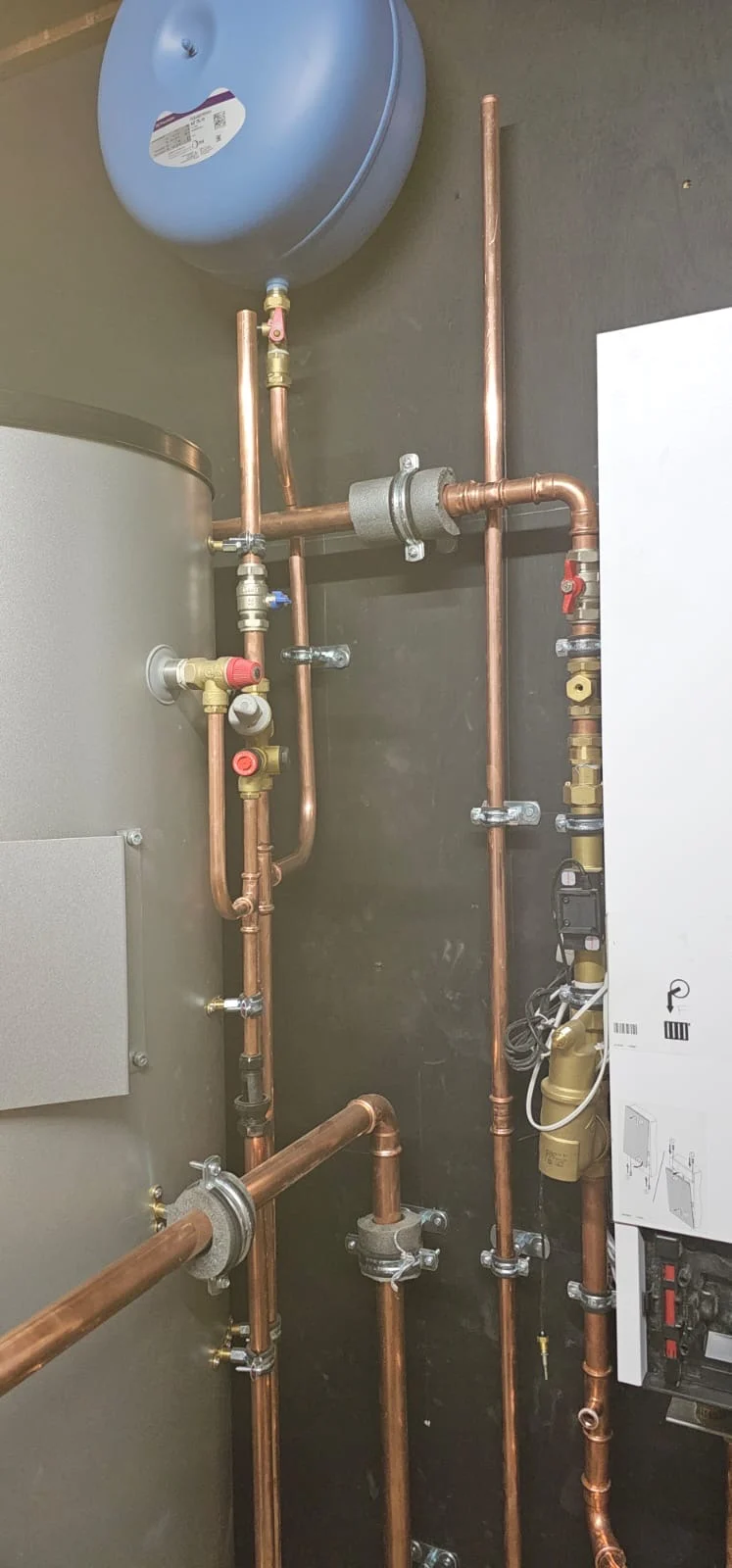 Copper pipework beneath the expansion vessel
