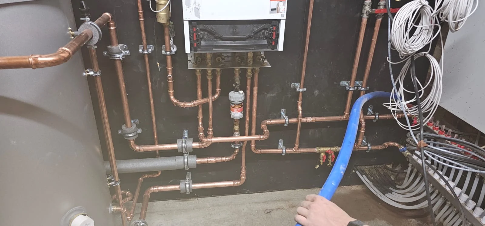 Plant pipework beneath the control unit