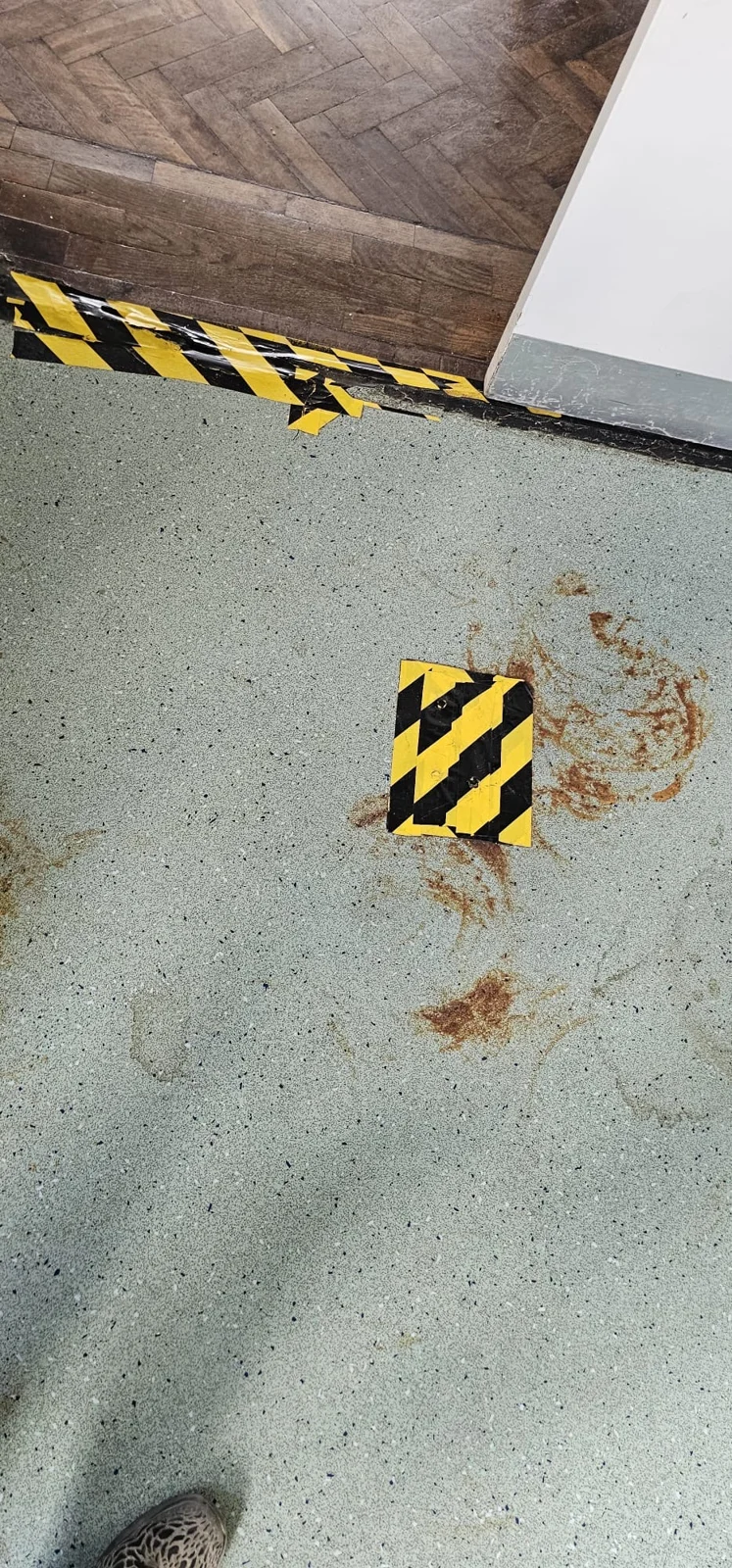 Floor opening marked with warning tape