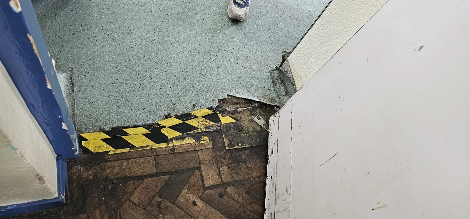 Threshold and exposed floorboards