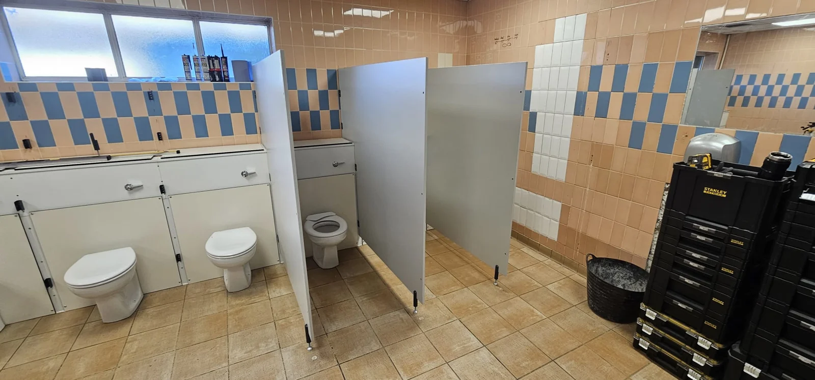 Cubicle partitions and toilet fittings